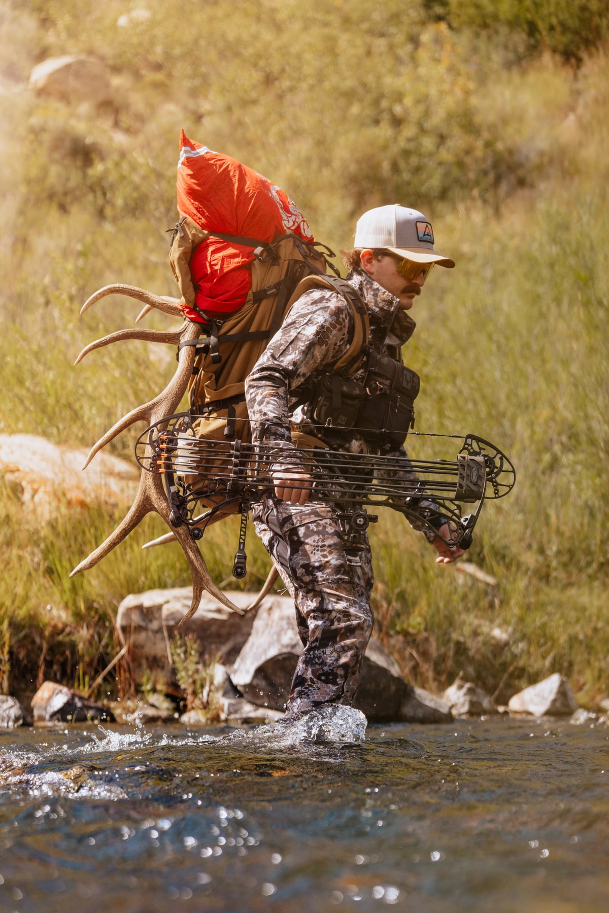 Hunter crossing a stream
